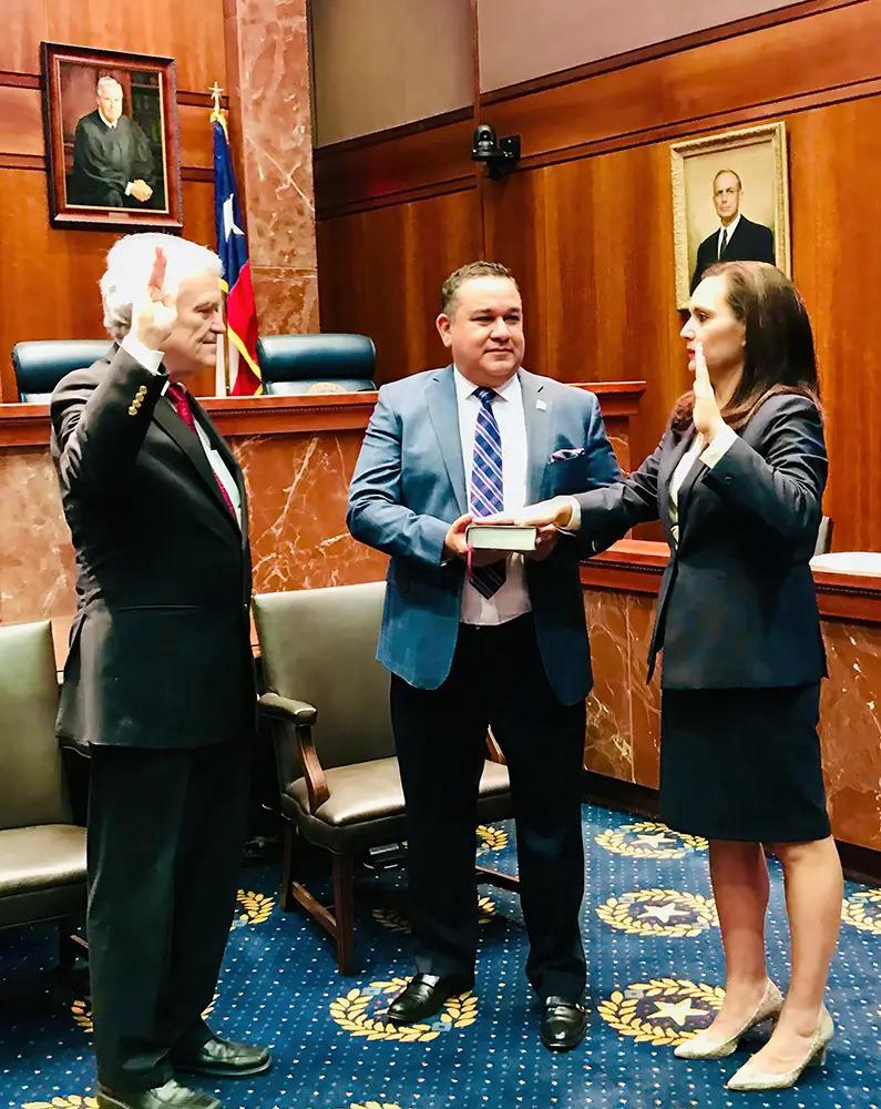 Lori Cobos briefing Governor Abbott during an energy project discussion